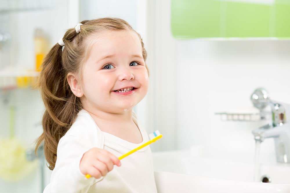 Child brushing teeth