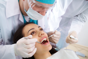 Dentist in Burwood solving dental problem of Client